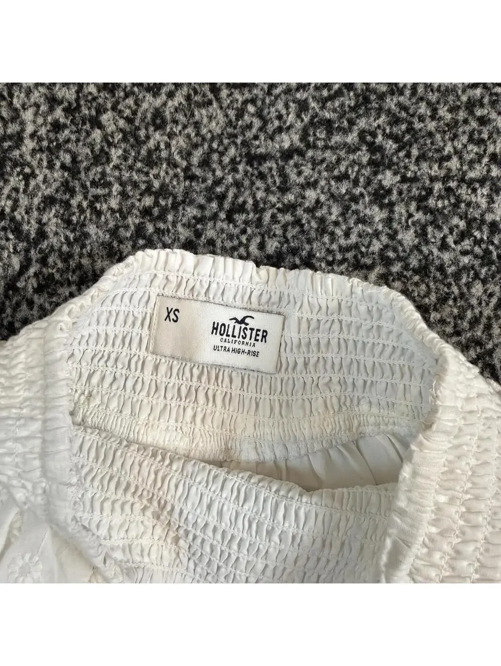 Hollister Co. white mini skirt with subtle floral embroidery, size XS